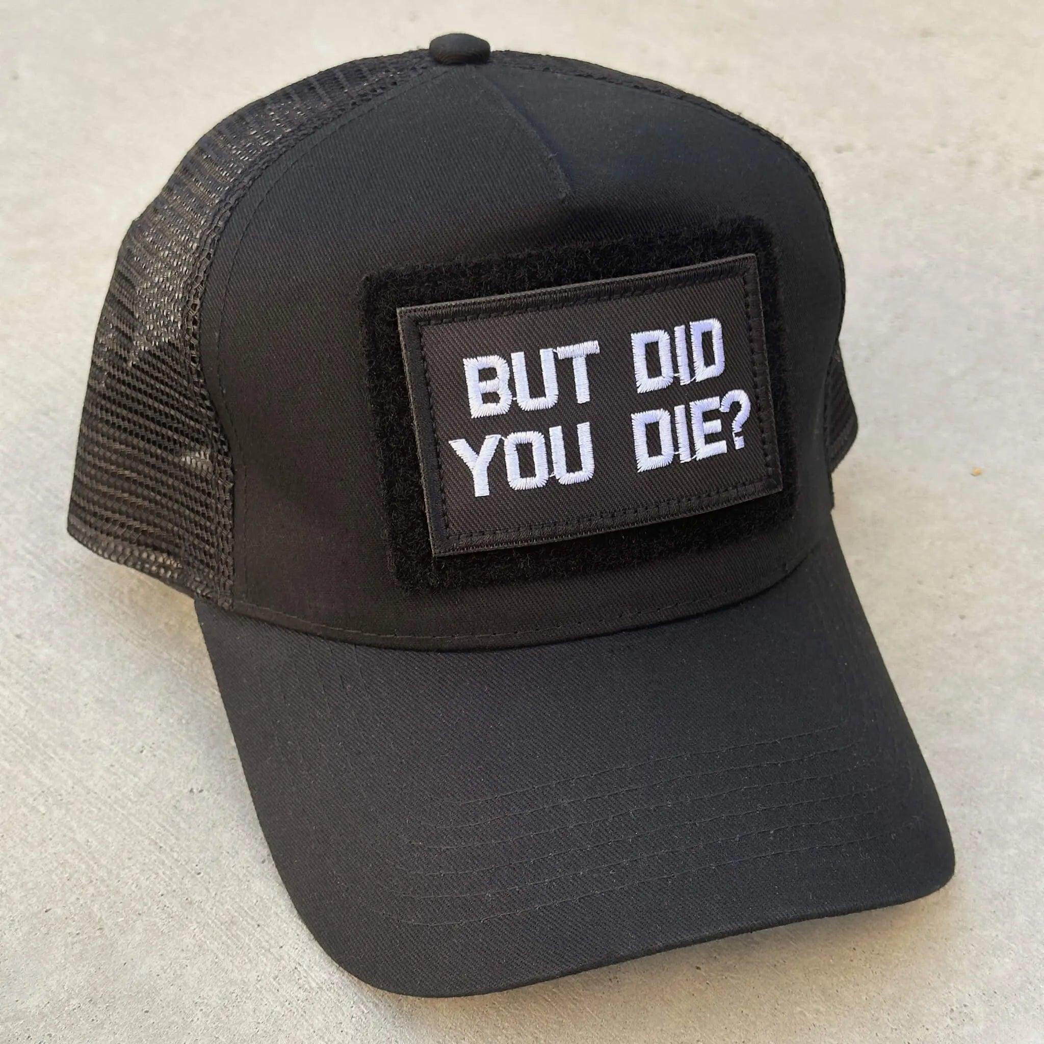 The trucker snapback cap in black with But Did You Die patch attached
