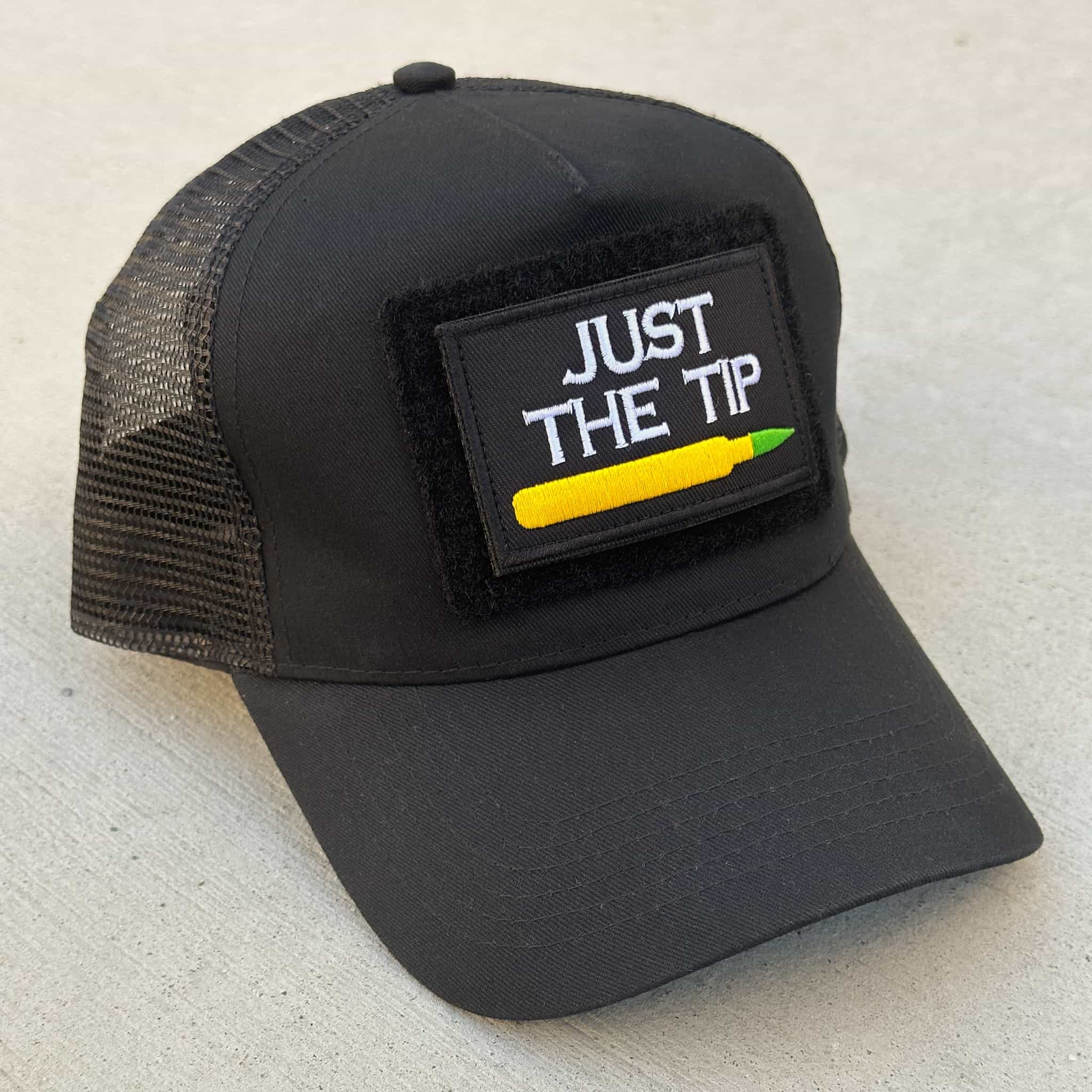 The Blank Canvas Snapback cap in black with the 'Just the Tip' patch attached
