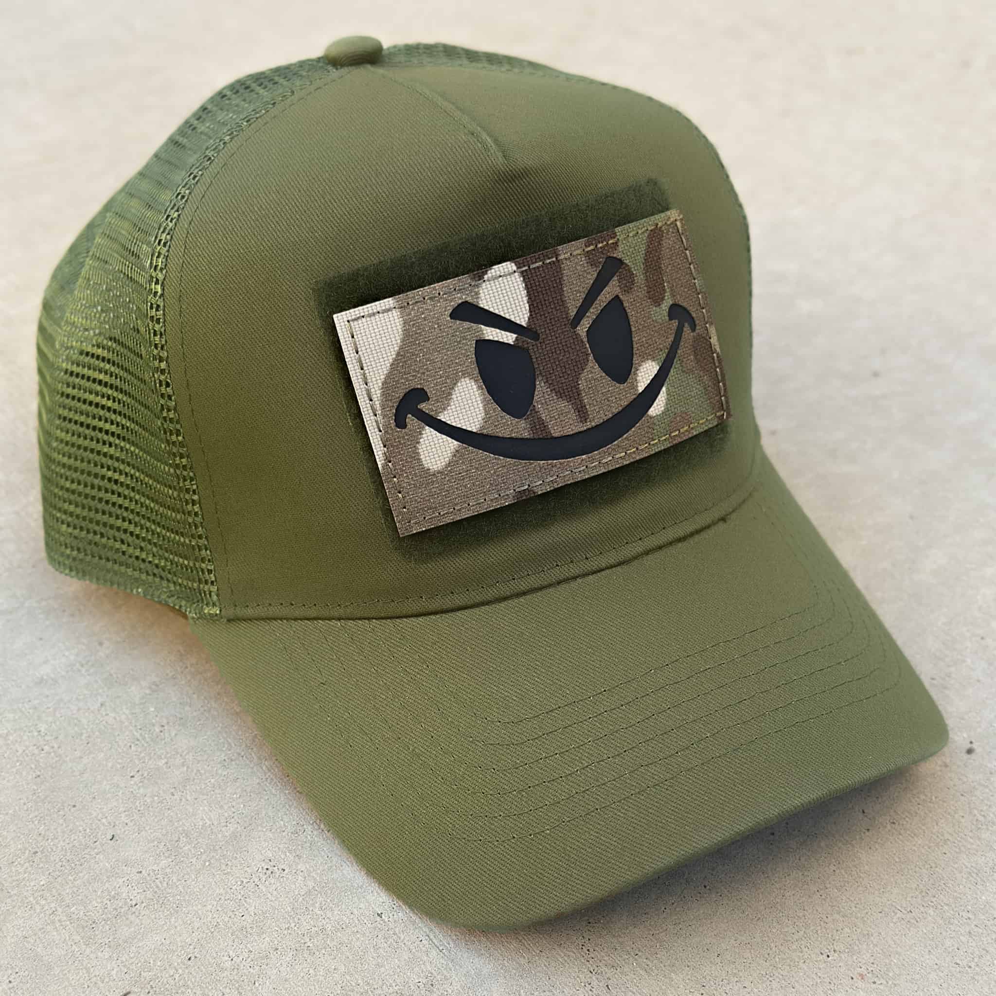 The Smiley cap in military green with camo military style smiley patch