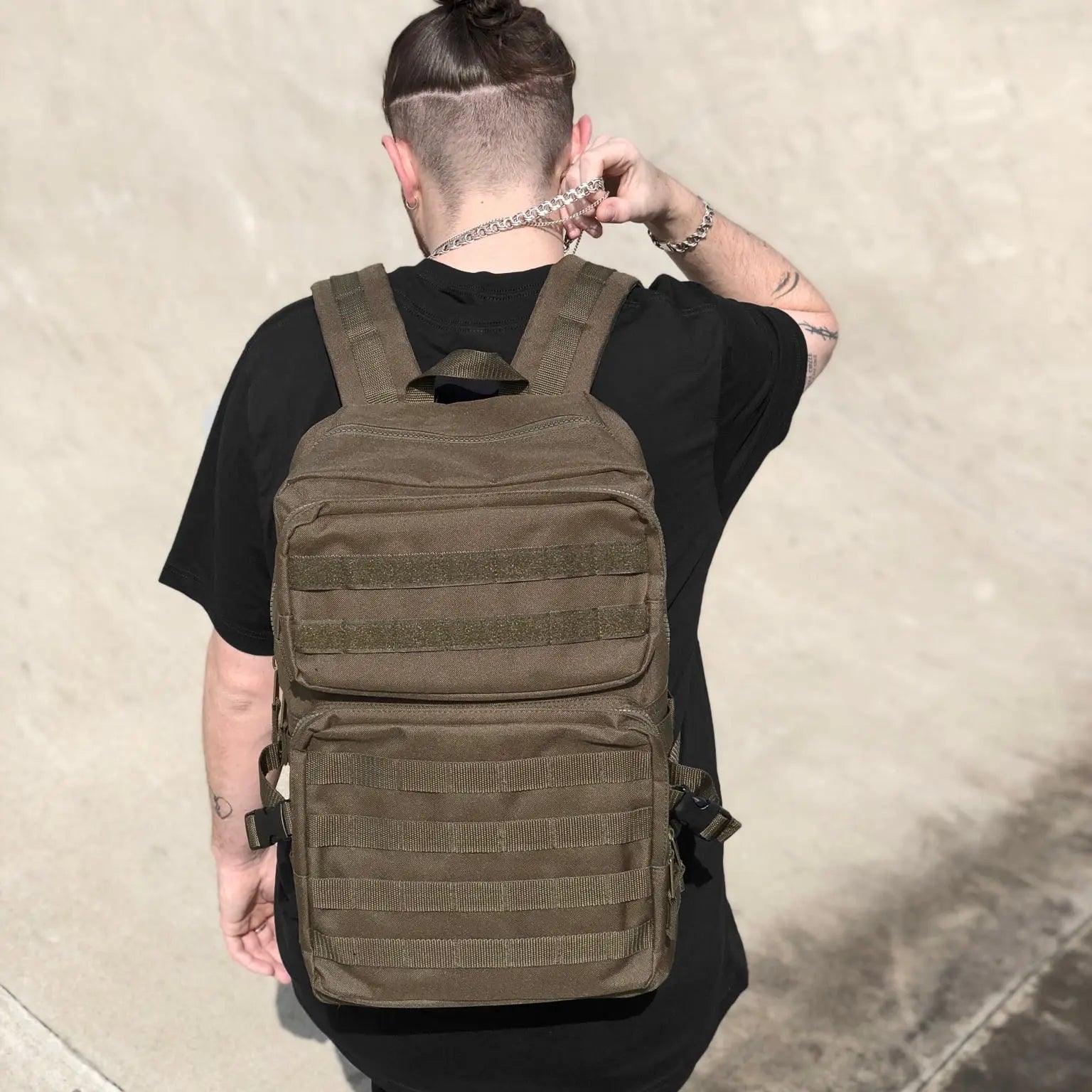 Model wearing the Tactical Bag in military green